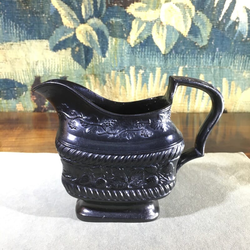 Black Basalt milk jug, strawberry moulded, c. 1820. -31083