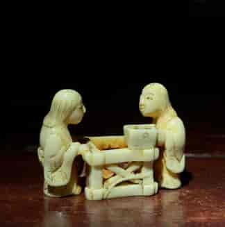 Japanese Ivory carving, two figures with a crate, c. 1890. -0