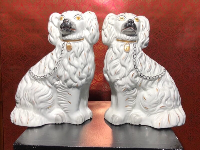Pair of Staffordshire spaniels, white with fine moulding, c. 1875. -0