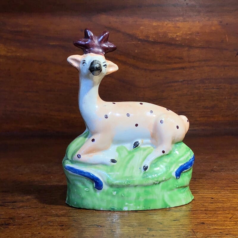 Staffordshire figure of a seated deer, c. 1810-0