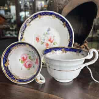 English porcelain trio, blue border and flower sprigs c.1830