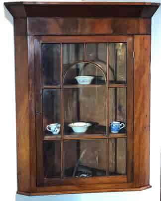 Mahogany corner cabinet with elegant astragal glazing, c. 1815