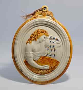 Pratt-type creamware plaque of a classical lady, c.1800