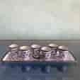 Set of 7 Persian enamel small beakers on tray, c. 1900