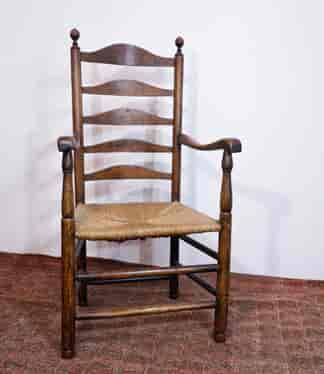 English elm ladderback armchair with rush seat, turned knobs, c.1800