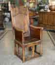French joined armchair, paneled sides, flower carved crest & dated 1778
