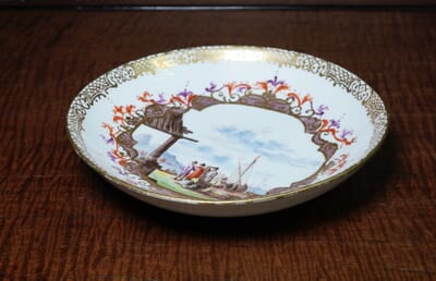 Meissen saucer with harbour scene, elaborate cartouche & Böttger