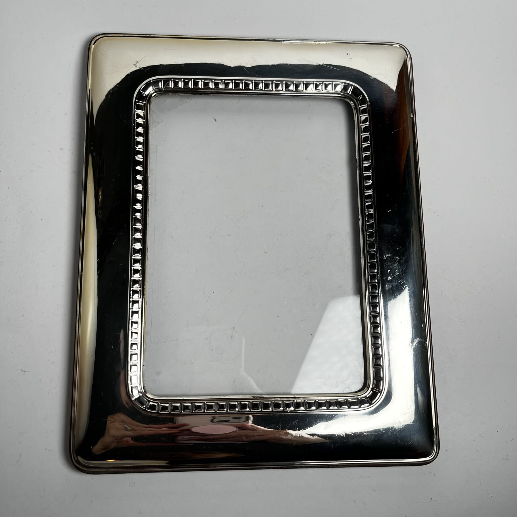 Continental 925 silver frame on wooden back, 20th C