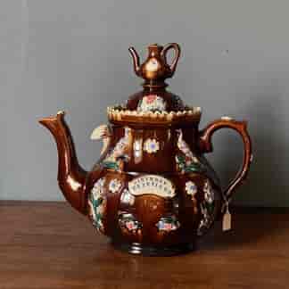 Bargeware teapot with deep brown glaze and sprigging of birds and flowers , c.1880