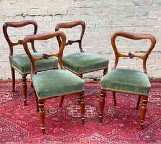 Four Victorian Rosewood balloon-back chairs, carved rail, c. 1860