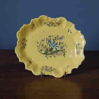 French yellow faience dish, Rococo form with flowers, attr. Montpellier c.1765