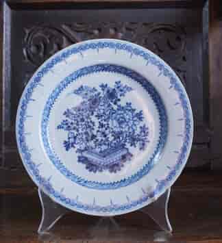 English delft plate, vase of flowers in scroll border, c.1760