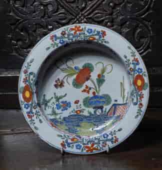 Italian tinglaze bowl with garden scene in colour, C. 1750