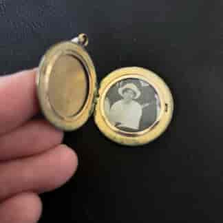 Small gold-plated locket, double photo, c. 1910