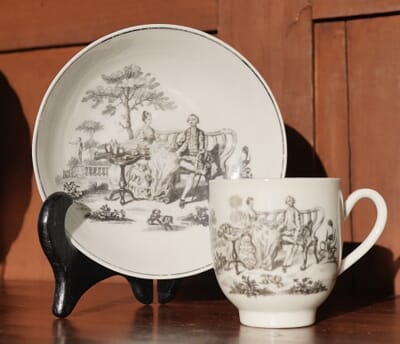 Worcester cup & saucer, Hancock 'Tea Party' print in black, c