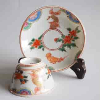 Japanese tea bowl and saucer, orange flowers and gilt dragons, c.1900