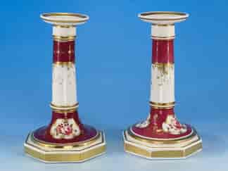 Pair of early Victorian porcelain candlesticks with claret ground, c.1845