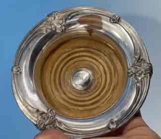 Old Sheffield Plate wine coaster with concave sides and wooden base, c.1830
