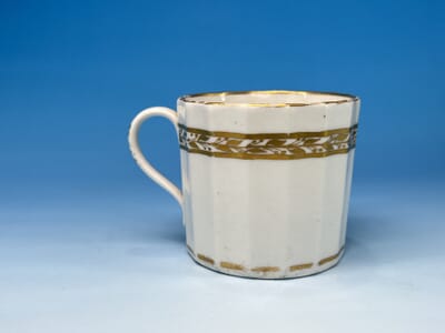 A Coalport Hamilton Fluted Porcelain Coffee Can and popular Saucer c1805