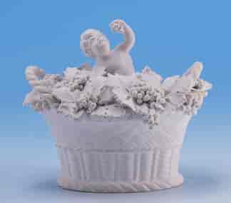Chamberlains Worcester bisque porcelain figure of cupid in basket of flowers, c. 1825