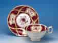 English porcelain cup & Saucer, claret ground with flower panels, C 1830
