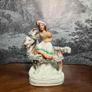 Staffordshire figure of the young Princess Royal (Victoria) riding a goat, C.1865