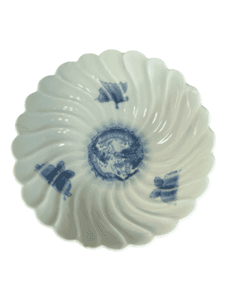 Japanese porcelain spiral fluted bowl with underglaze blue butterflies and central dragon, c.1900