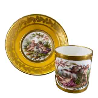 Sèvres cup & saucer with finely painted panels of cherubs & goat, 18th & 19th century