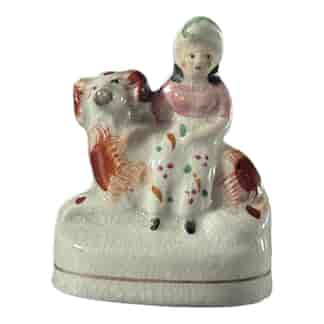 Small Staffordshire spaniel dog with child on back, c.1840