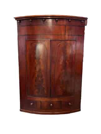 Late Georgian mahogany corner cupboard, bow front with inlay, c. 1820