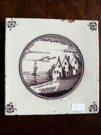 Dutch Delft manganese tile, houses by the sea, c. 1800