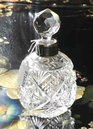 Cut glass perfume bottle with sterling mount, 1933