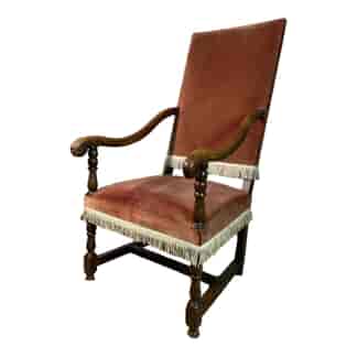 French fauteuil with faded red velvet upholstery and fringe, C. 1700