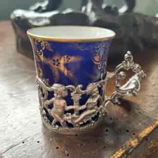 Copeland porcelain coffee demitasse with silver cherub mount, 1903