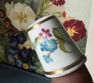 Royal Worcester thimble, hand-painted with a flower spray, signed S. Rob