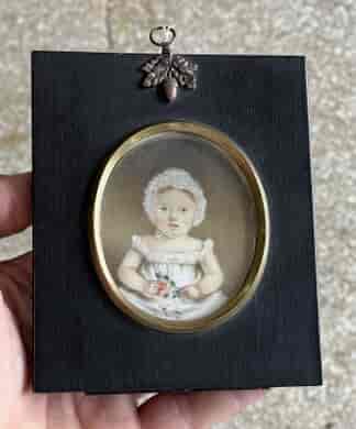 Portrait miniature of a small girl with rose, early 19th century