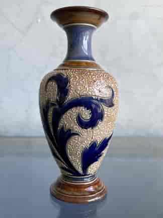 Small Doulton Lambeth vase with blue scrolls on intricate impressed and raised ground, Circa 1885