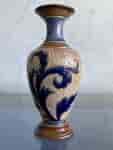Small Doulton Lambeth vase with blue scrolls on intricate impressed and raised ground, Circa 1885