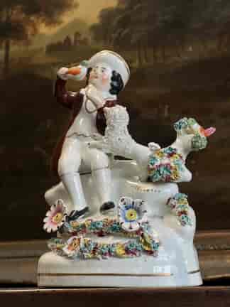 Staffordshire pottery figure, boy with birds, nest & dog, C.1830