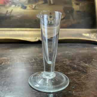 Small victorian measuring beaker in millilitres