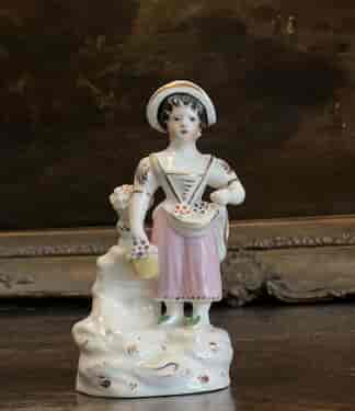 Staffordshire porcelain figure of a flower girl, c. 1830