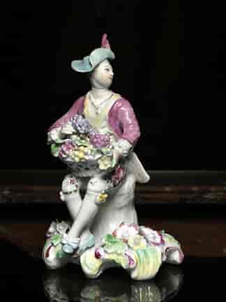 Rare Derby 'Pale Family' figure of 'Summer', man with basket of grapes, 1756-9