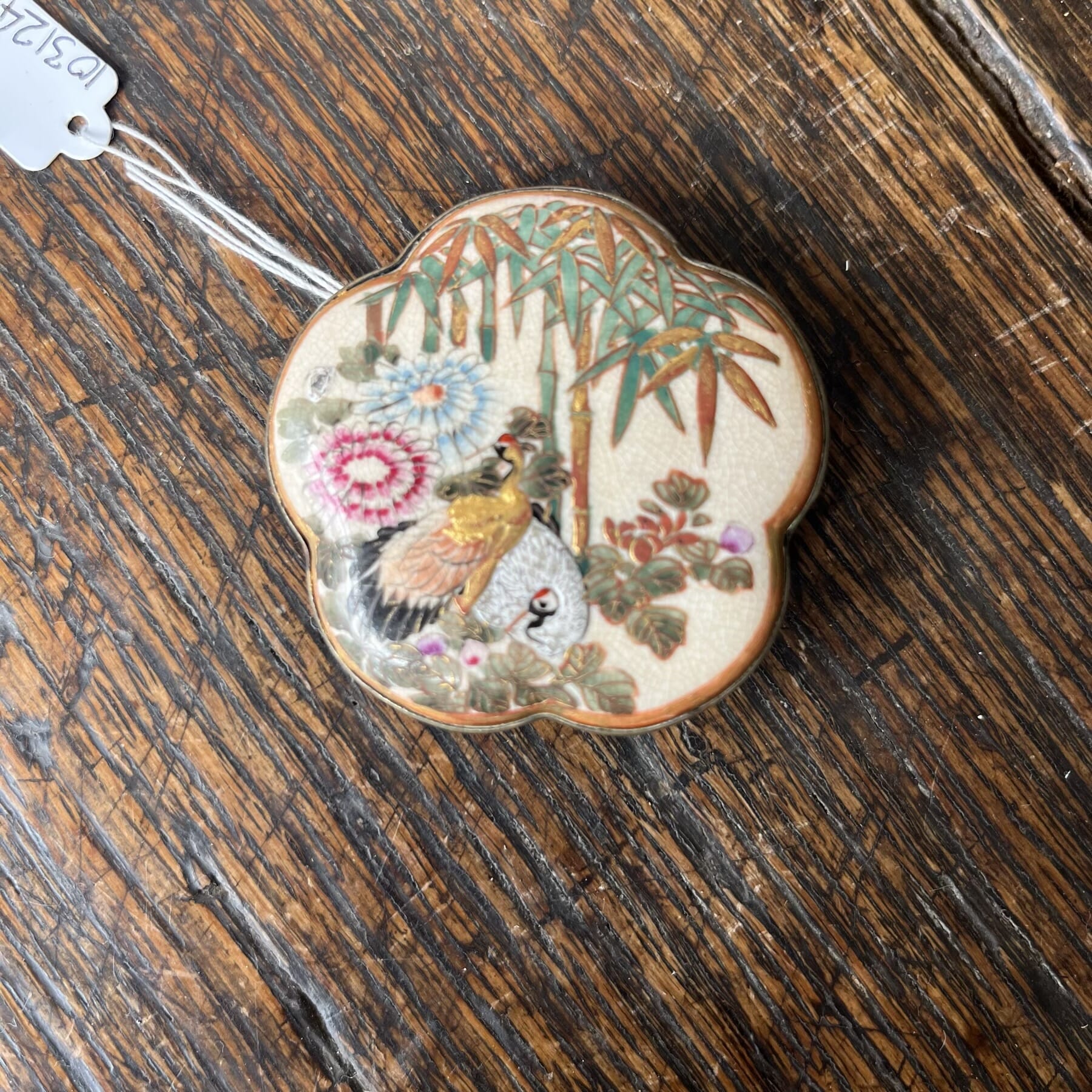 Satsuma belt buckle, cranes in a garden, 19th century