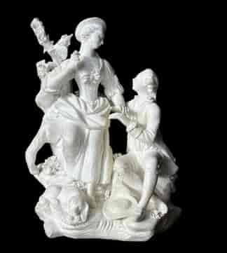 Beautiful biscuit porcelain model , 'Pastoral Group with dog', with a gallant seated on a pile of rocks interacting with a standing bareheaded lady, a tree in the background, the reverse with a seated goat.   Inscribed ‘N72’, also modeller’s mark ‘K’      Circa 1790 