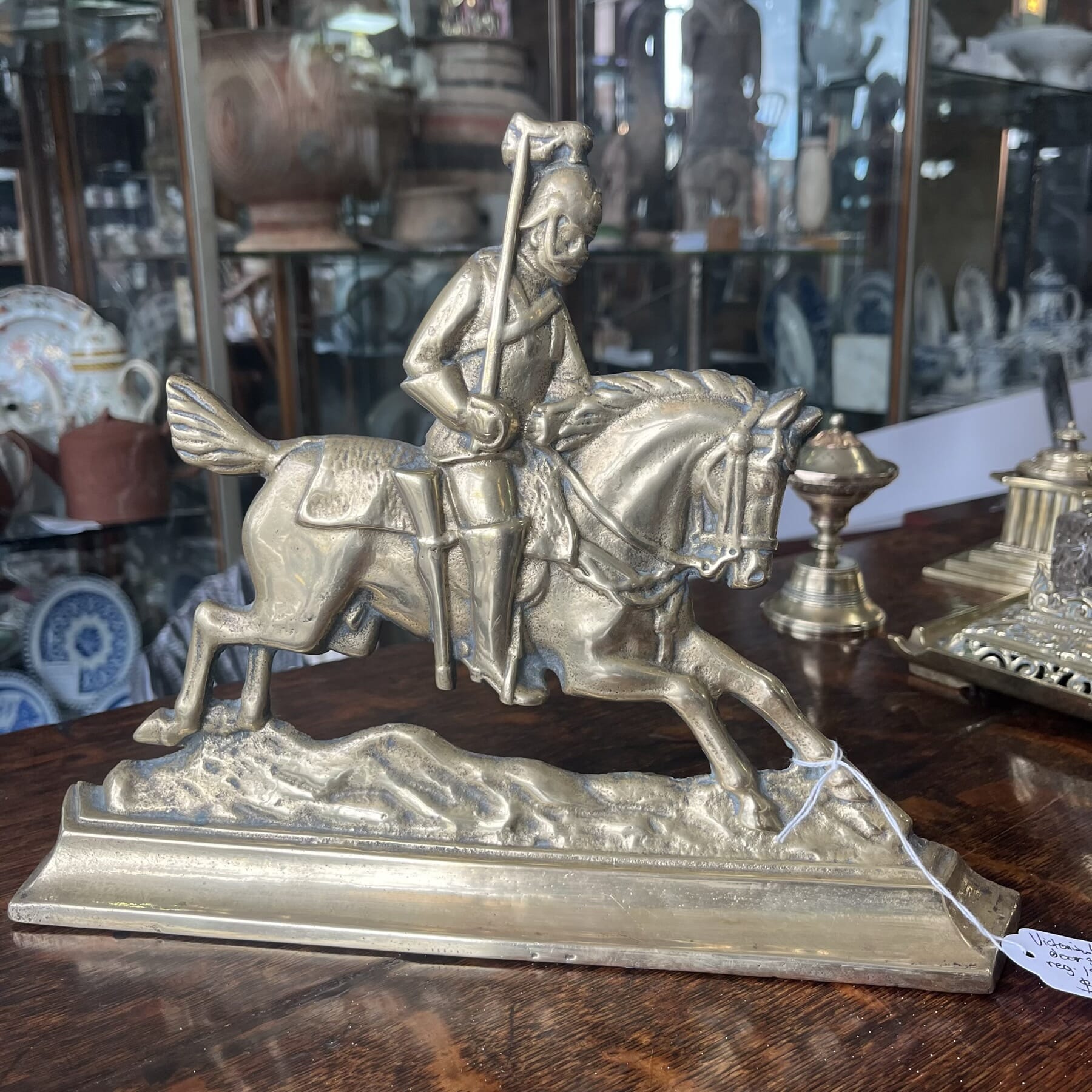 Brass doorstop, cavalry officer on horseback, reg. 1893