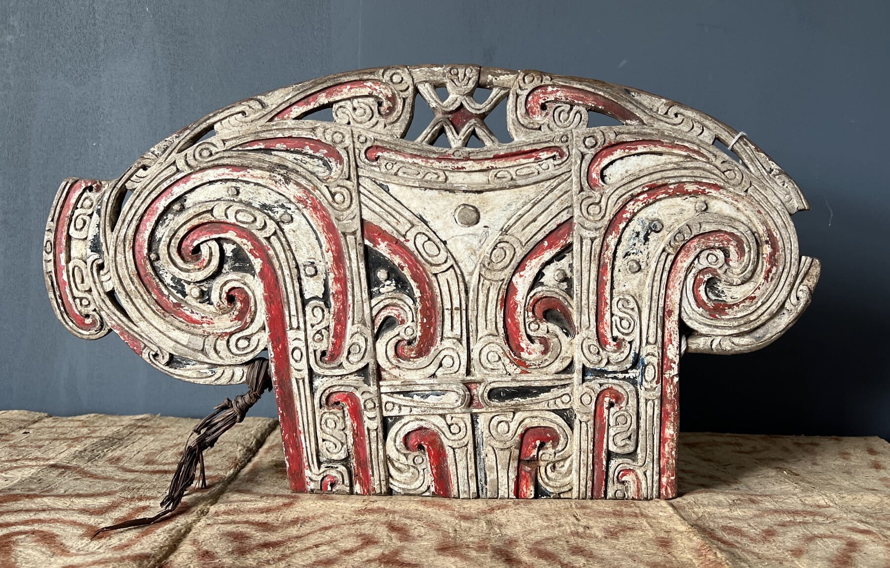 Trobiand Islands - Massim - canoe board, figure & scrolls, red + white, earlier 20th c.