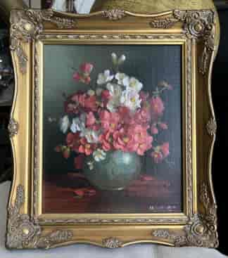 Oil painting of a vase of red and white blossoms, Late 20th C