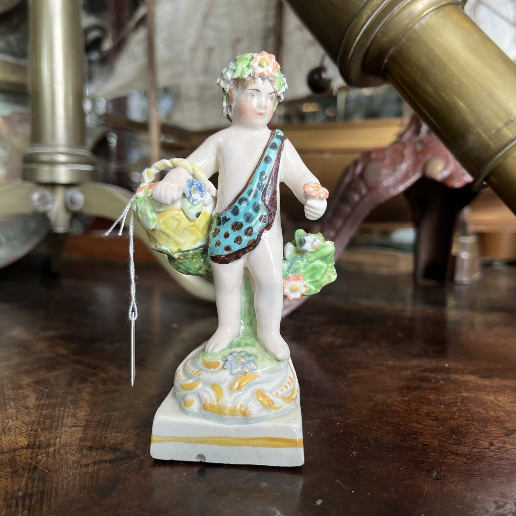 Early Staffordshire figure of a flower boy, c. 1810