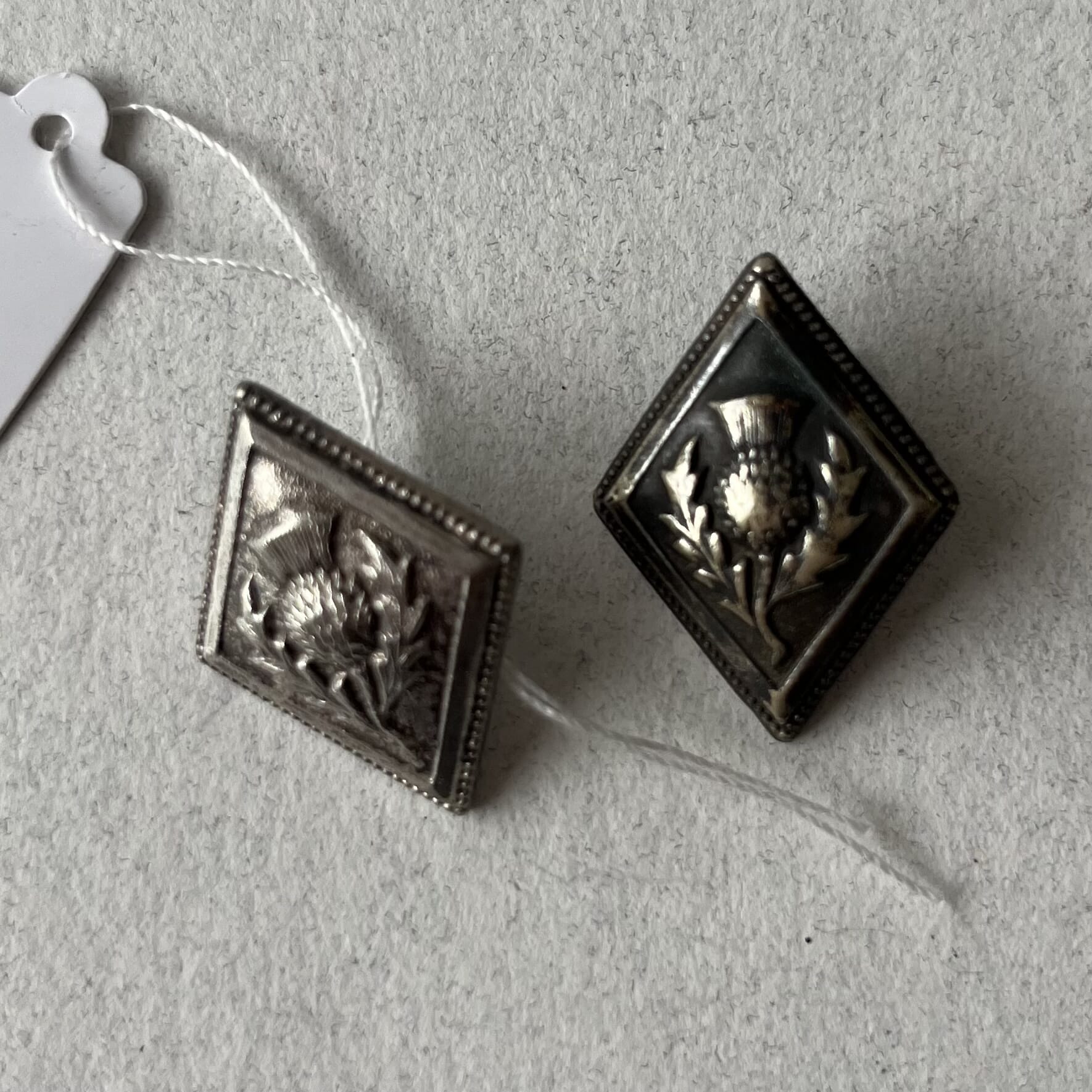 Scottish Silverplate thistle hat bosses, 20th c.