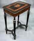 French Ebonized and amboyna venner work table  with musical trophy and ormolu mounts,   c. 1870